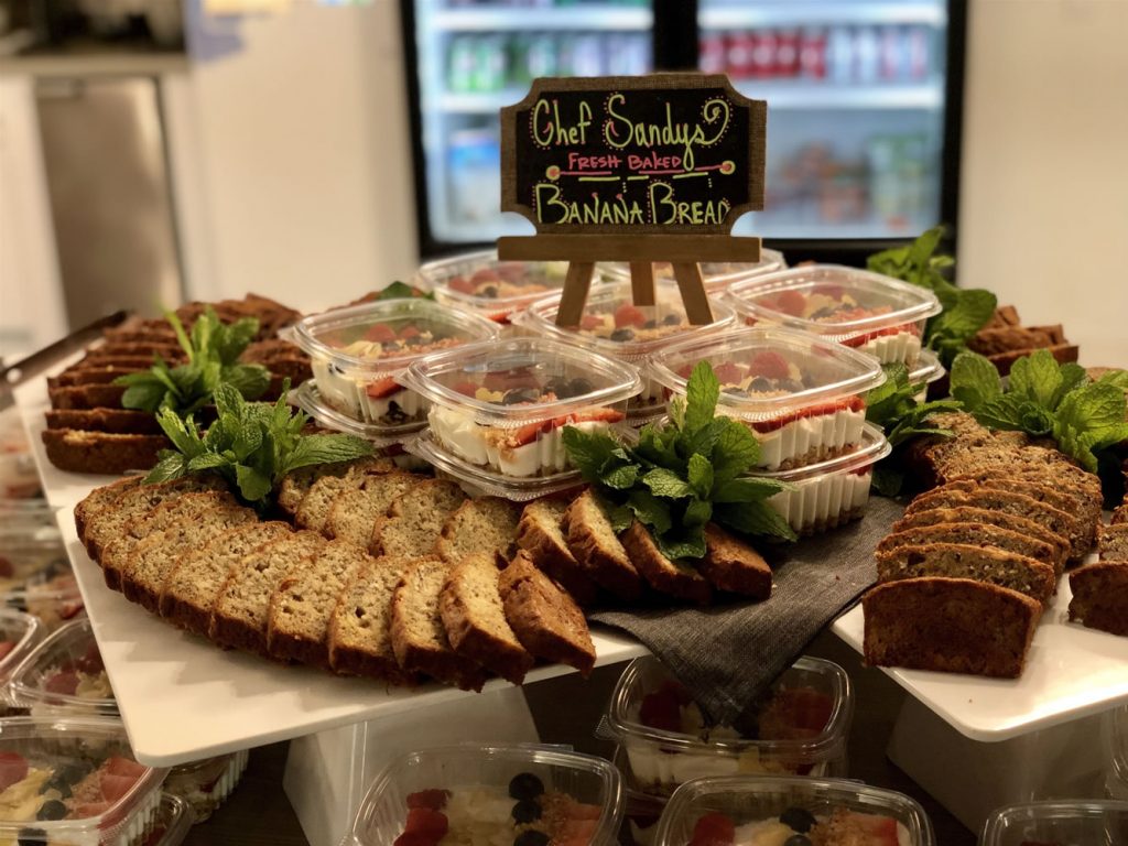 A catered spread of roasted vegetables, canapés and small plates arranged for an event