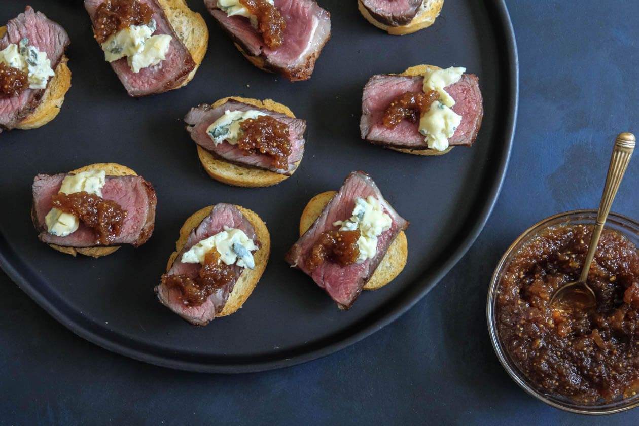 Hors d'oeuvres prepared in the Monterey kitchen, arranged on a dark serving platter